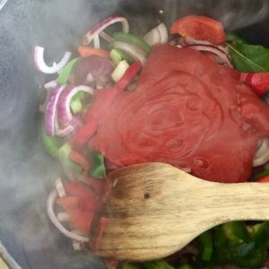 Lightly cook the vegetables in vegetable oil, then add the tomatoes