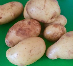 Choose small new potatoes and cut them in half