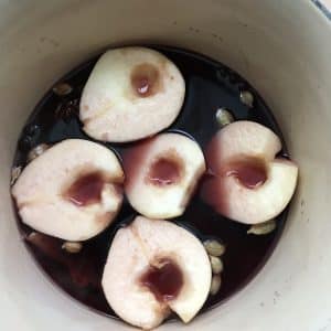 Cook the pears in the wine with the spices
