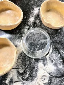 Shaping tart over a ramekin dish