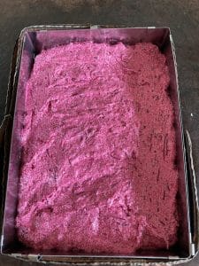 Beetroot cake mixture in tin